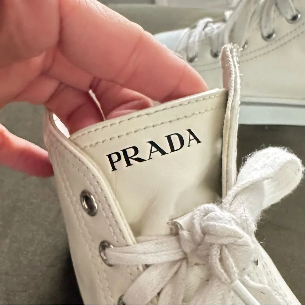 PRADA all white leather high top sneakers size 34 with original box on real real